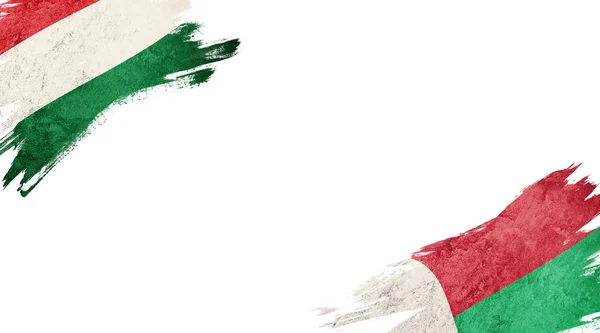 Vlajky Maďarska a Madagaskaru na bílém pozadí — Stock fotografie